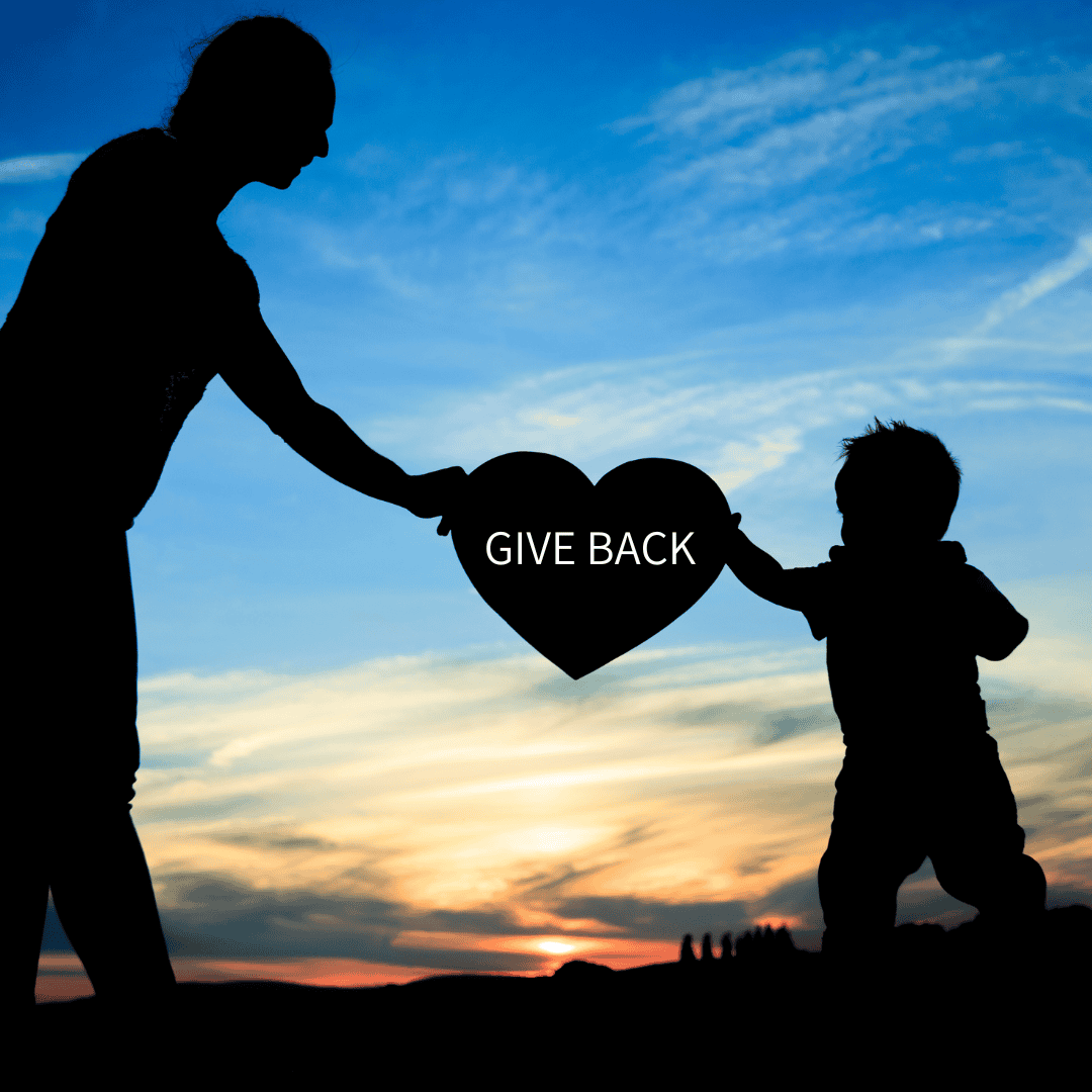 Elderly person giving back a heart to a toddler with sunset behind